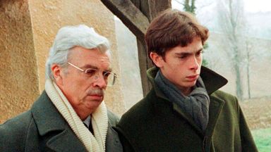 Film producer Daniel Toscan du Plantier (L) attends the funeral of his wife Sophie, with her son Pierre-Louis near Toulouse in 1996